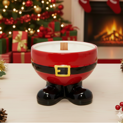 Santa boot-shaped candle holder with Christmas tree and fireplace in the background