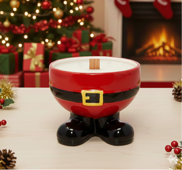 Santa boot-shaped candle holder with Christmas tree and fireplace in the background